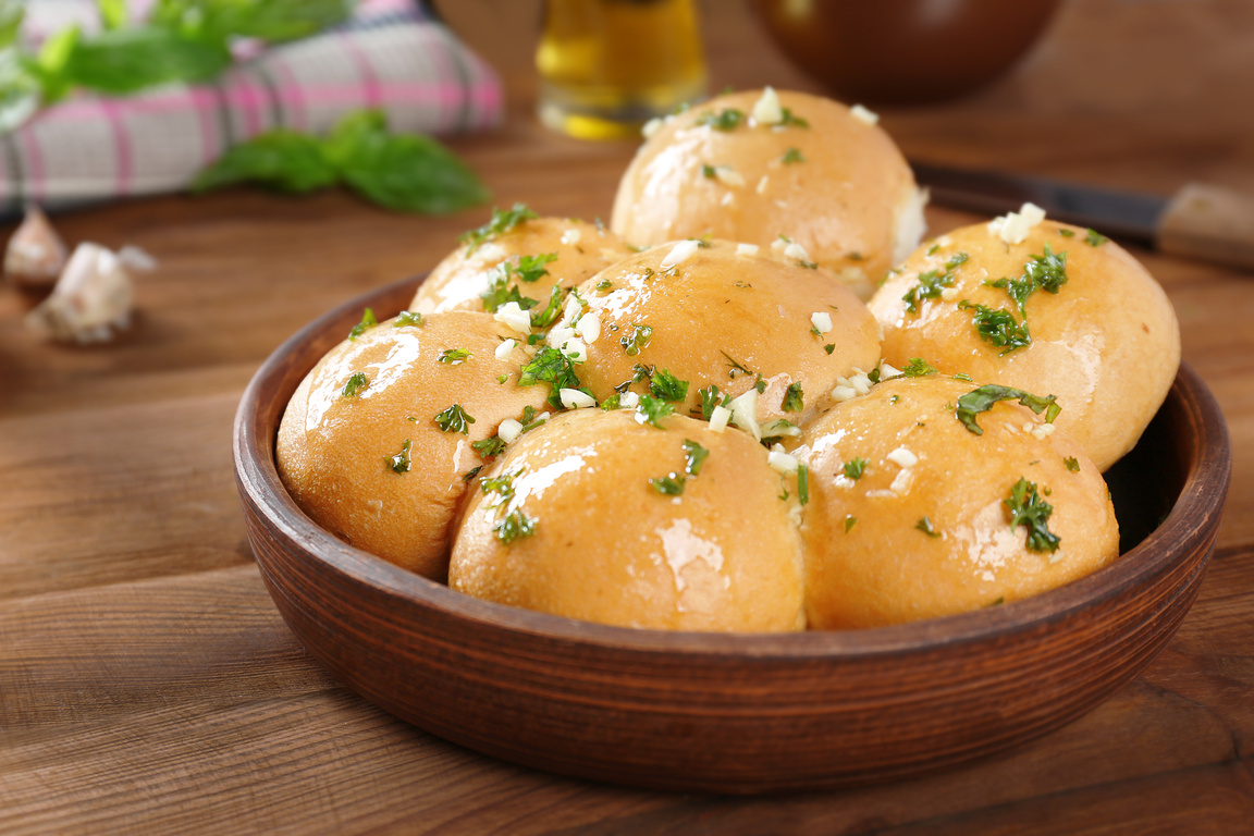 Wooden Bowl with Garlic Bread Rolls 