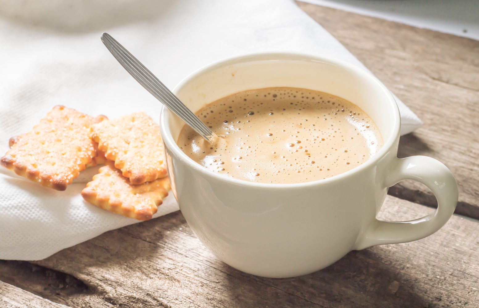 Creamy coffee with biscuit