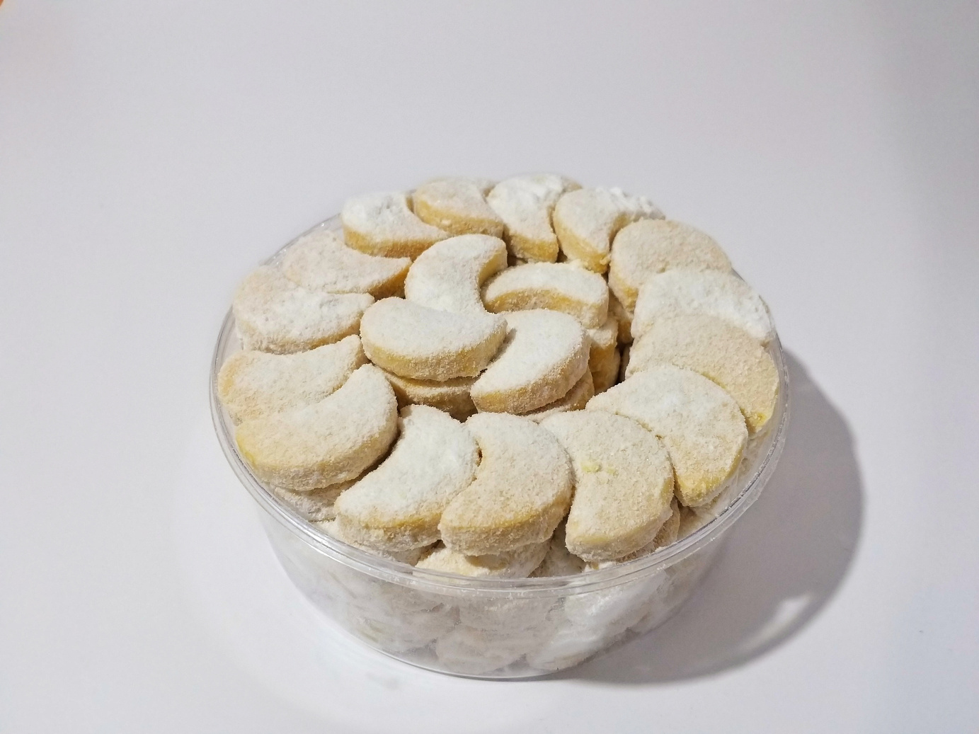 Putri Salju or crescent-shaped cookies coated with powdered sugar